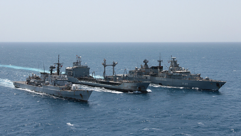 Military vessels in the sea.