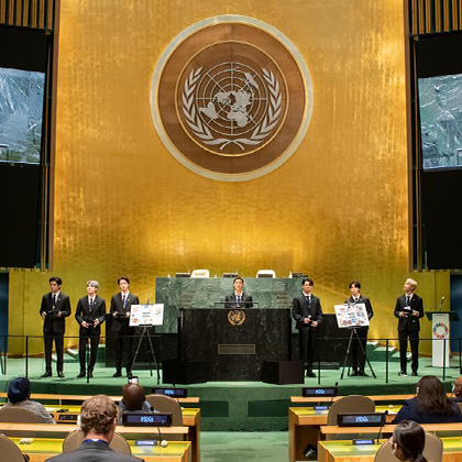 Popular boy band standing on the stage at the UN General Assembly after their speech