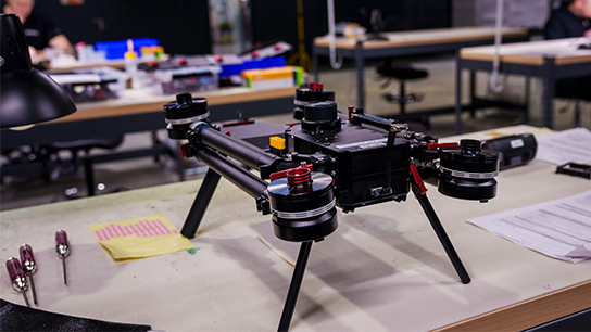 A drone on a desk in a laboratory.