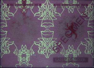 LUX-AP-02004 - 
                    <Zadn&iacute; strana >
                     - Jištěn&iacute; v UV světle